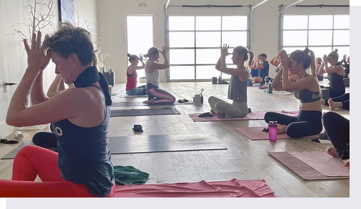 Full yoga class with instructor in front of class