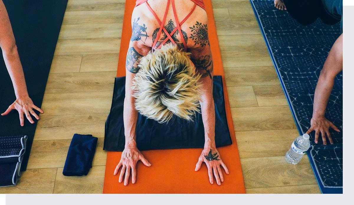 Overhead of yoga student lying on mat