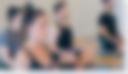 Yoga students sitting in class with eyes closed